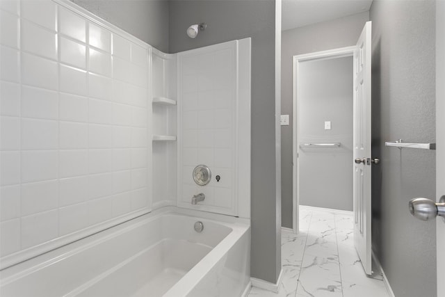 full bath with baseboards, marble finish floor, and shower / washtub combination