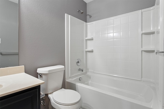 full bath with vanity, shower / bathing tub combination, toilet, and a textured wall