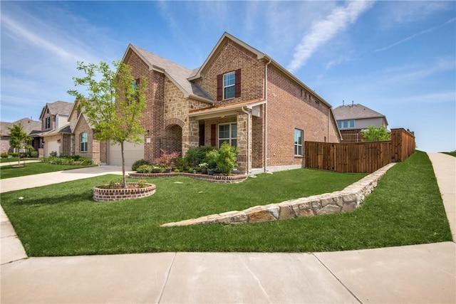 traditional home with driveway, brick siding, a front yard, and fence