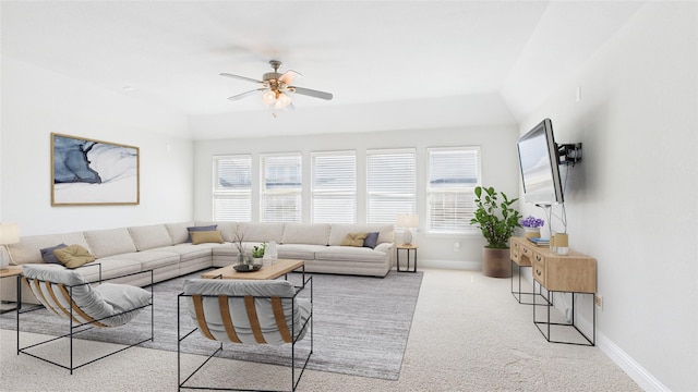 carpeted living area with a ceiling fan, lofted ceiling, and baseboards