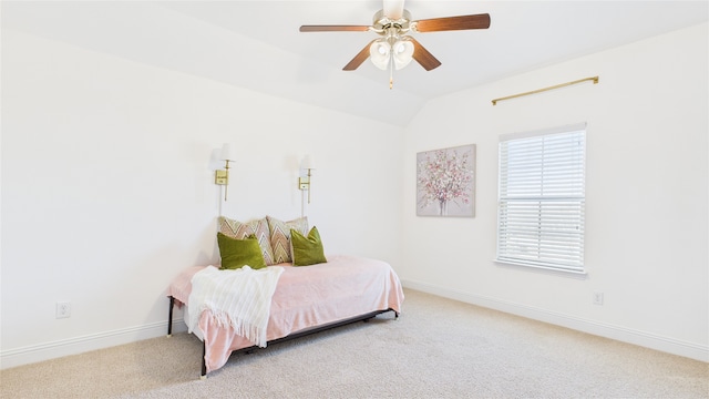 carpeted bedroom featuring vaulted ceiling, ceiling fan, and baseboards