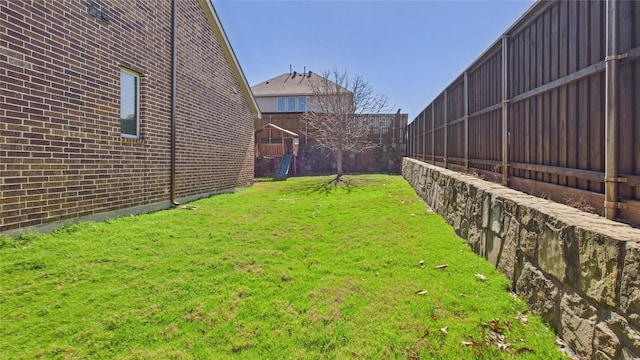 view of yard featuring a fenced backyard