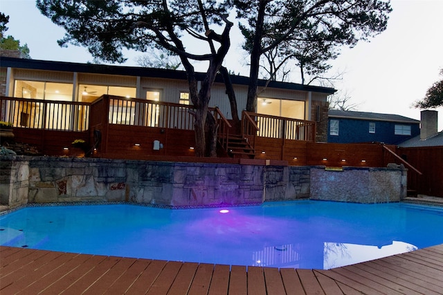 outdoor pool featuring a deck