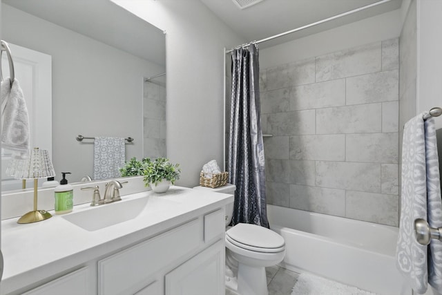 bathroom with toilet, tile patterned floors, shower / bath combo with shower curtain, and vanity