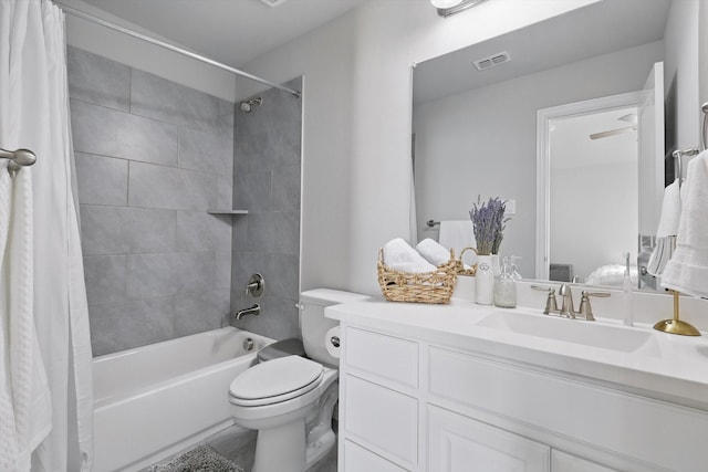 bathroom featuring toilet, visible vents, shower / bath combination with curtain, and vanity