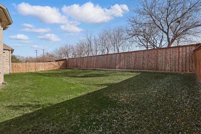 view of yard featuring a fenced backyard