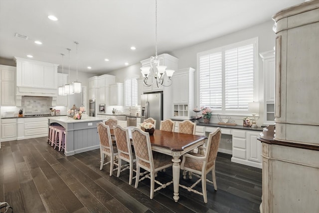 dining area featuring recessed lighting, dark wood-style flooring, visible vents, and a notable chandelier