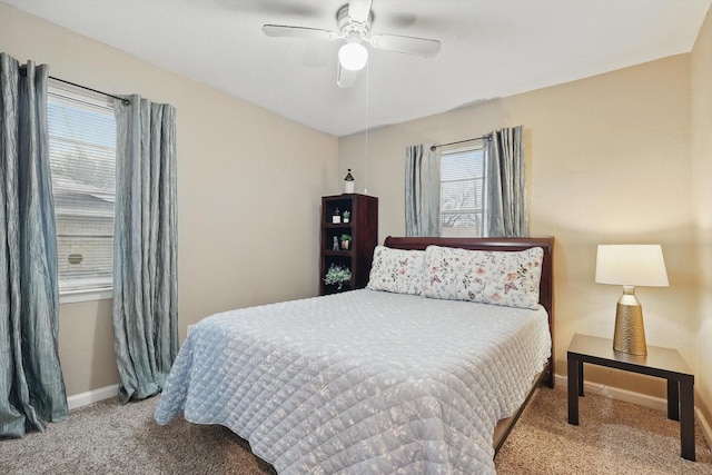 bedroom featuring ceiling fan, carpet, and baseboards