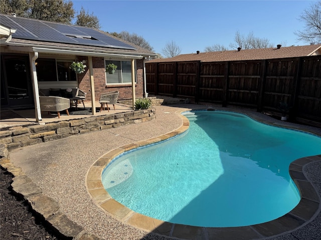 view of pool with a fenced backyard, a fenced in pool, and a patio