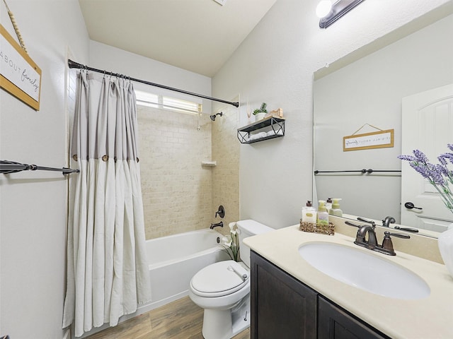 full bath featuring vanity, wood finished floors, toilet, and shower / tub combo with curtain