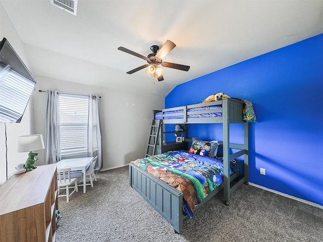 bedroom with carpet floors, visible vents, vaulted ceiling, and ceiling fan