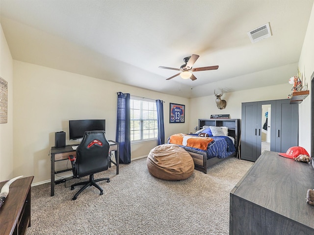 bedroom with baseboards, visible vents, ceiling fan, and carpet flooring