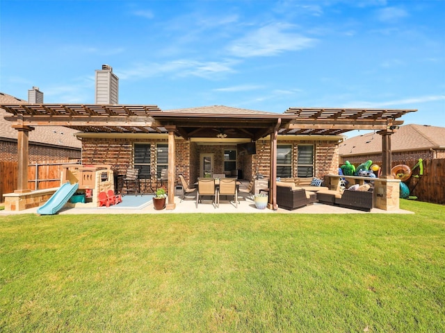 back of property with a fenced backyard, an outdoor hangout area, and a lawn