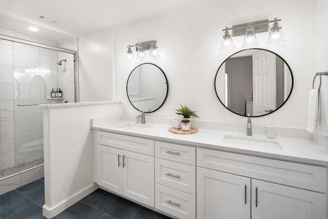 full bath featuring a stall shower, visible vents, a sink, and tile patterned floors