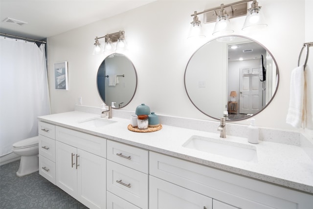 full bathroom featuring visible vents, a sink, toilet, and double vanity