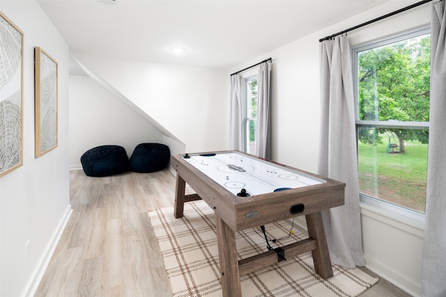 game room featuring baseboards and wood finished floors