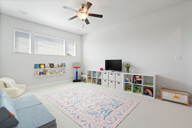 game room with carpet flooring, visible vents, ceiling fan, and baseboards