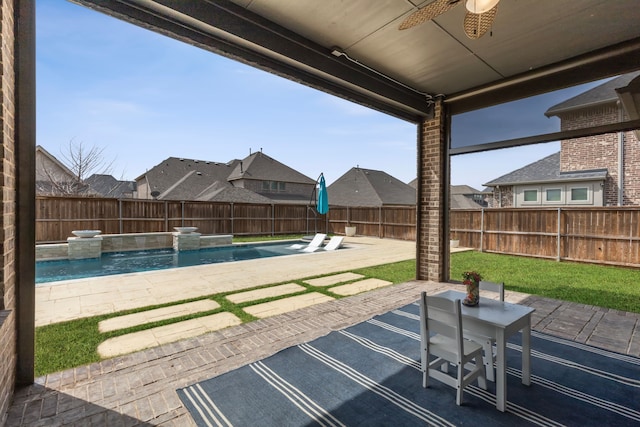 view of patio featuring a ceiling fan, a fenced in pool, and a fenced backyard