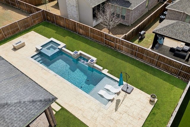 view of pool with a fenced backyard, a pool with connected hot tub, a lawn, and a patio