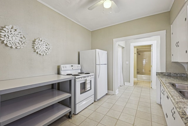 kitchen featuring white appliances, a sink, white cabinetry, light countertops, and crown molding