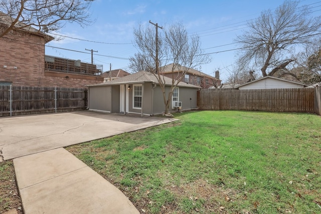 view of yard with a patio and a fenced backyard