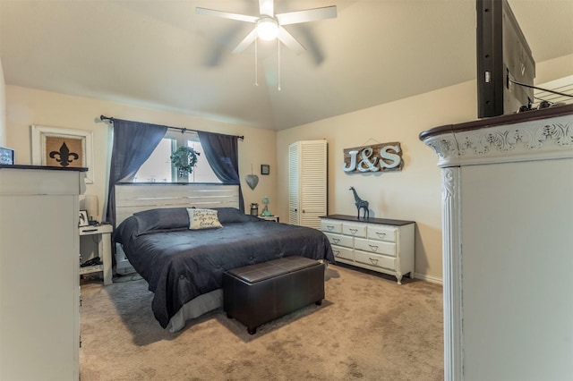 bedroom with light carpet, lofted ceiling, and a ceiling fan