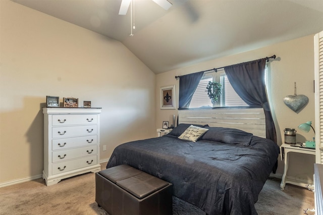 bedroom with light carpet, baseboards, vaulted ceiling, and a ceiling fan