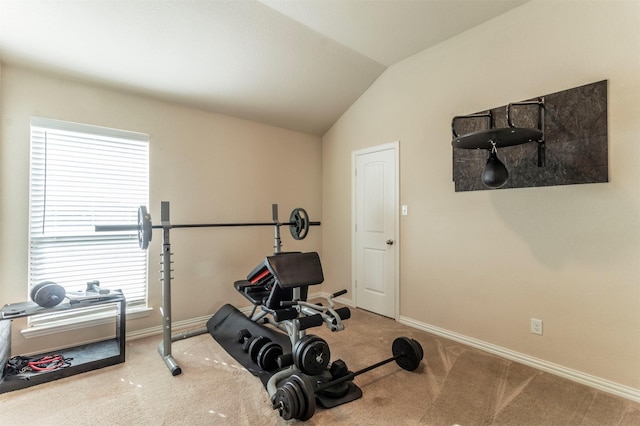 workout area featuring lofted ceiling, carpet, and baseboards