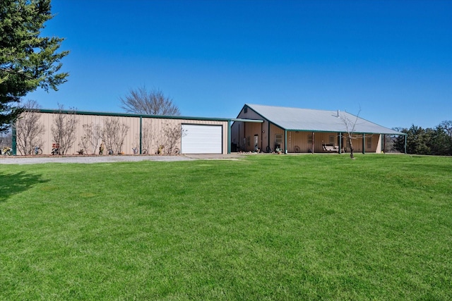 ranch-style home featuring a garage and a front lawn