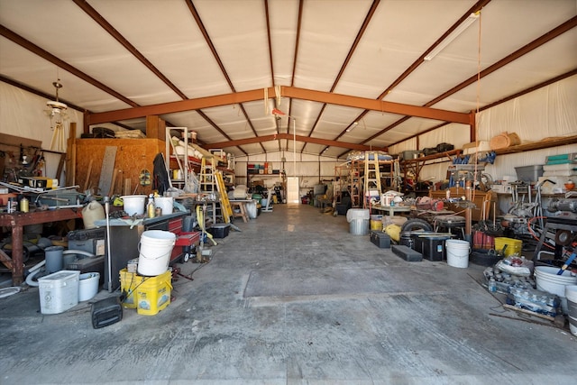 garage with a workshop area and metal wall