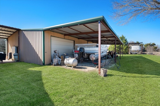 view of vehicle parking featuring a pole building and a detached garage