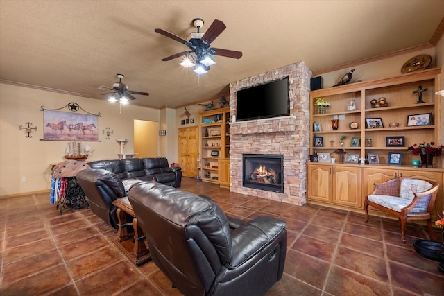 living room with a textured ceiling, dark tile patterned floors, a fireplace, a ceiling fan, and crown molding