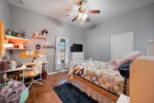 tiled bedroom featuring ceiling fan, visible vents, and baseboards