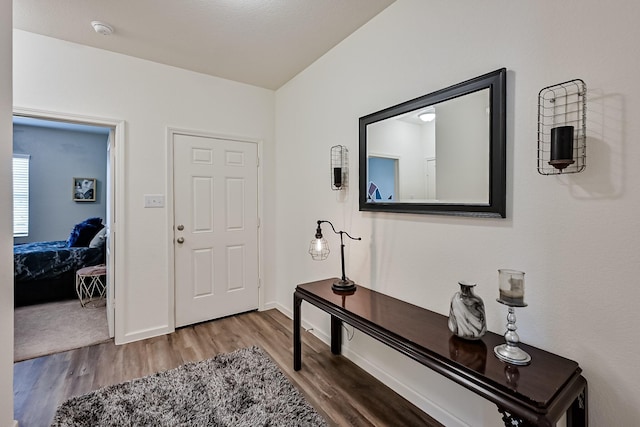 entrance foyer with wood finished floors and baseboards