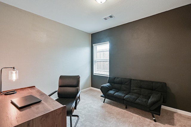 office area with baseboards, visible vents, and carpet flooring