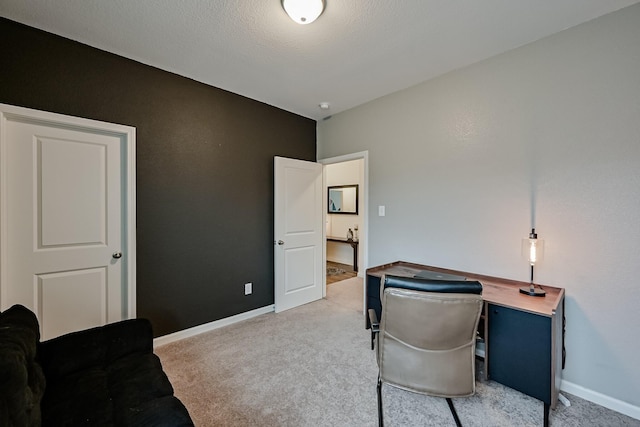 office space featuring light colored carpet and baseboards