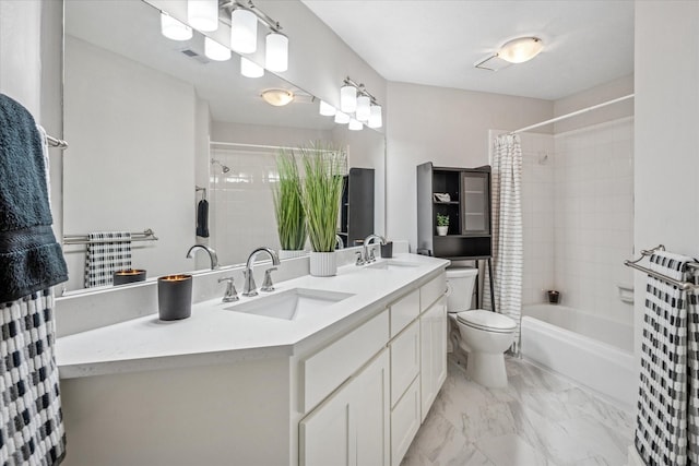 full bathroom featuring toilet, visible vents, marble finish floor, and a sink