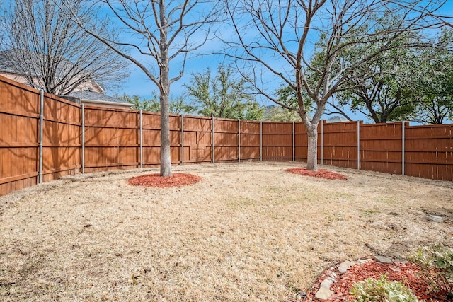 view of yard with a fenced backyard