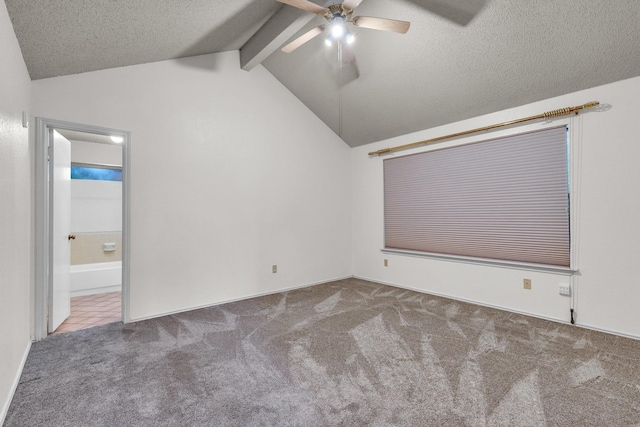 carpeted spare room featuring vaulted ceiling with beams, a textured ceiling, and ceiling fan