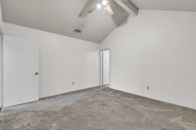 empty room featuring visible vents, ceiling fan, a textured ceiling, carpet flooring, and beam ceiling