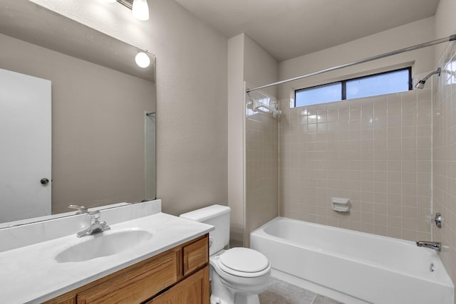 full bath featuring bathing tub / shower combination, vanity, toilet, and tile patterned floors