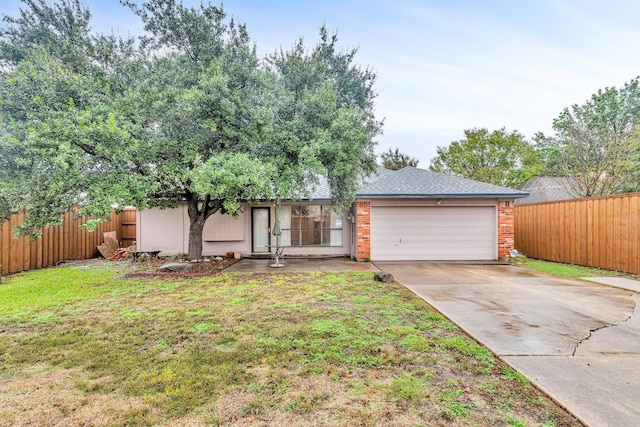 view of front of home featuring brick siding, concrete driveway, fence, a garage, and a front lawn