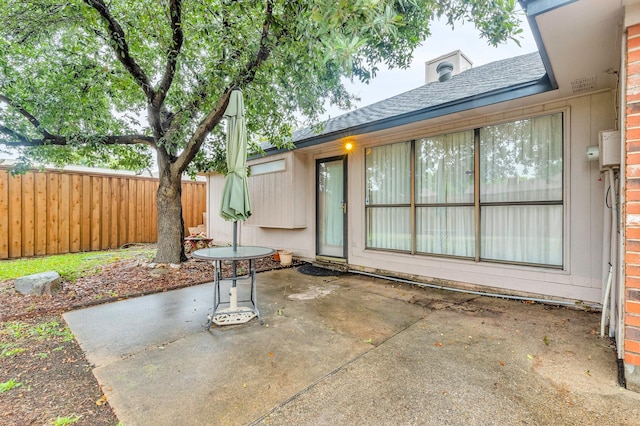 view of patio / terrace featuring fence