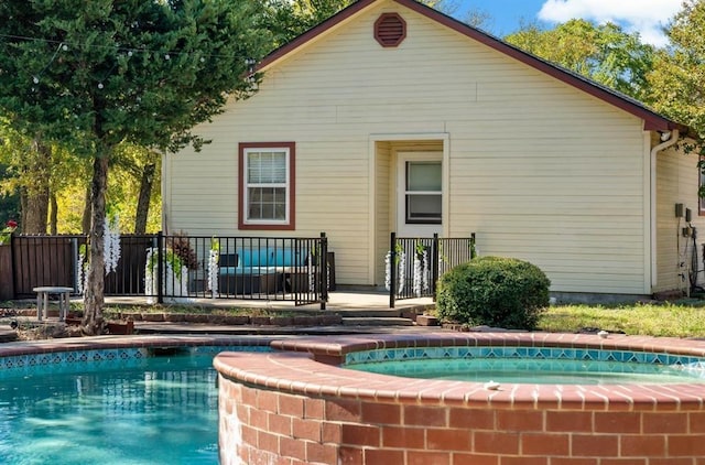 12900 Fm 121, Van Alstyne, TX 75495 - back of property featuring a pool with connected hot tub and fence