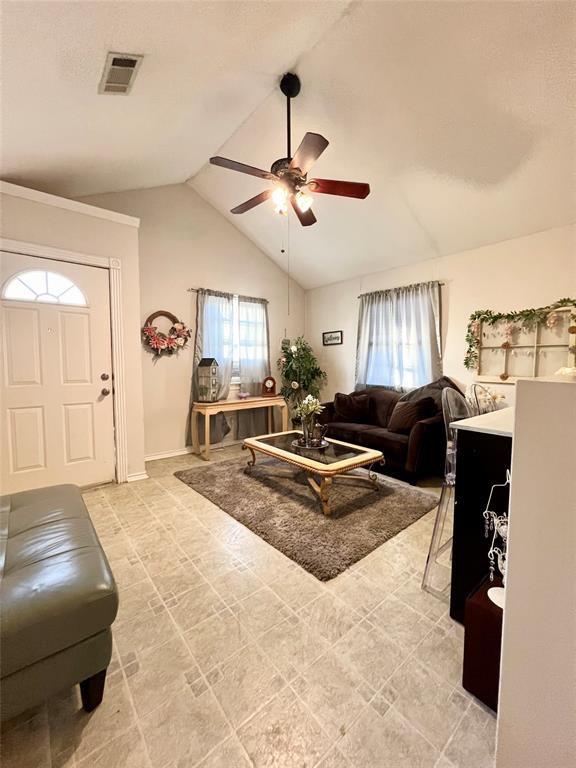 12900 Fm 121, Van Alstyne, TX 75495 - living area with lofted ceiling, ceiling fan, and visible vents
