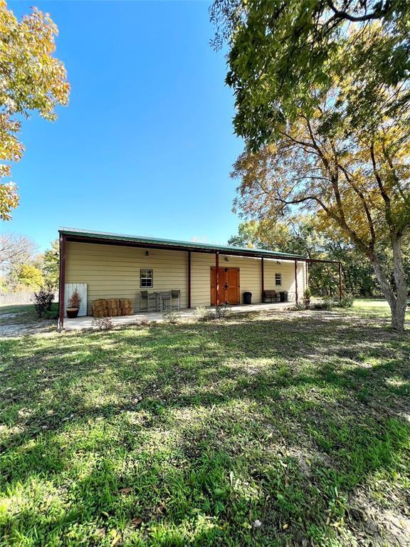 12900 Fm 121, Van Alstyne, TX 75495 - rear view of property featuring a patio area and a yard