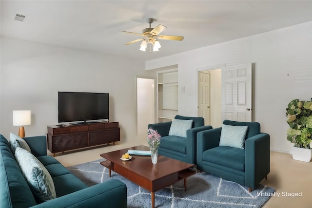12900 Fm 121, Van Alstyne, TX 75495 - carpeted living area featuring visible vents and ceiling fan