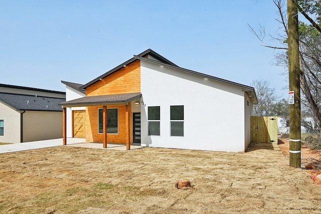 back of house featuring a patio area and stucco siding