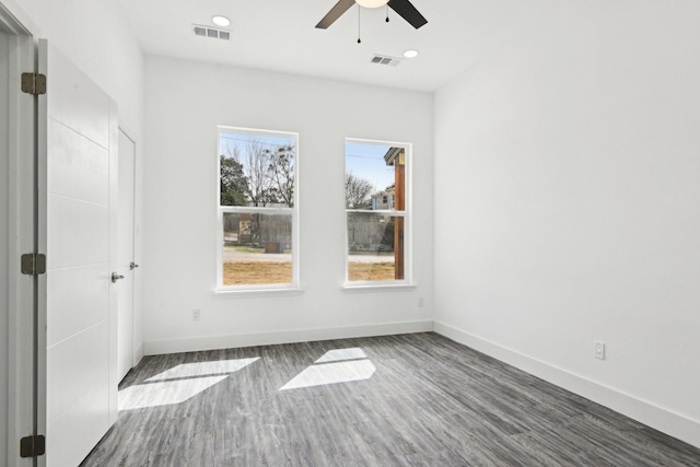 empty room featuring baseboards, visible vents, a ceiling fan, wood finished floors, and recessed lighting