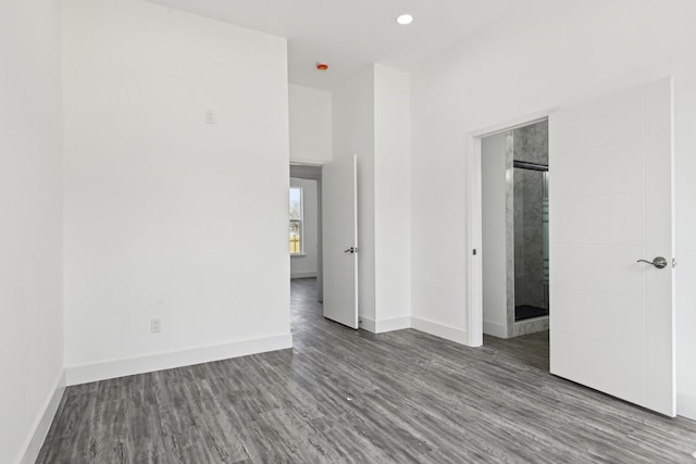 unfurnished bedroom with recessed lighting, baseboards, and wood finished floors